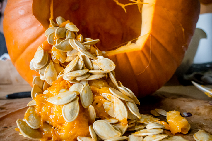 cut open pumpkin showing seeds and benefits of pumpkin