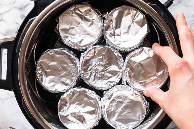 eggs in individual jars in instant pot covered in foil for sous vide egg bites recipe