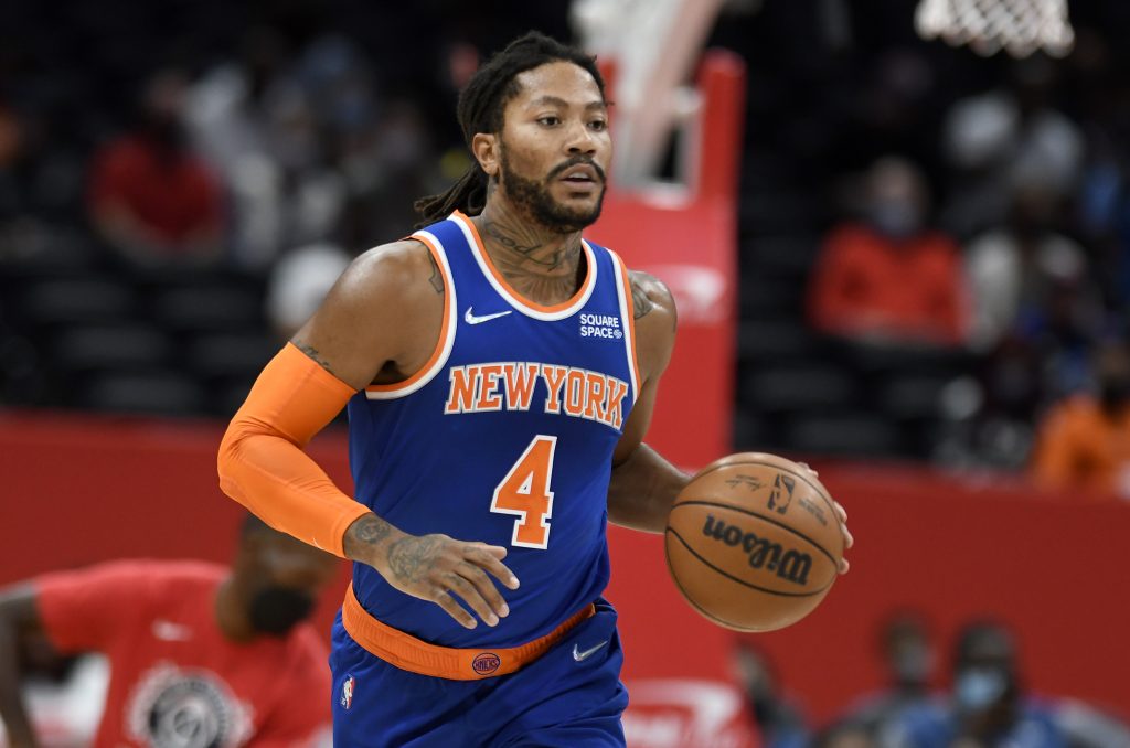 Knicks guard Derrick Rose dribbles the ball during a preseason game