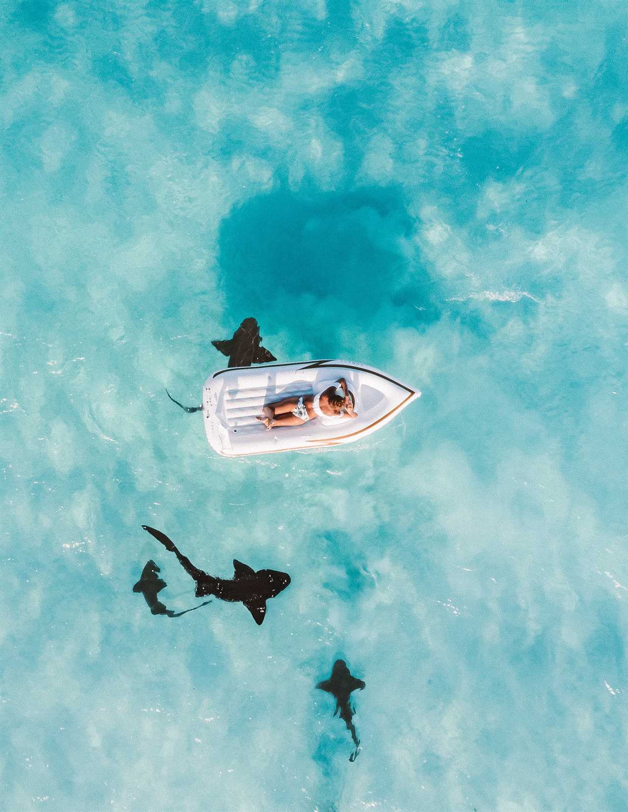 girl floating on a boat in bahamas