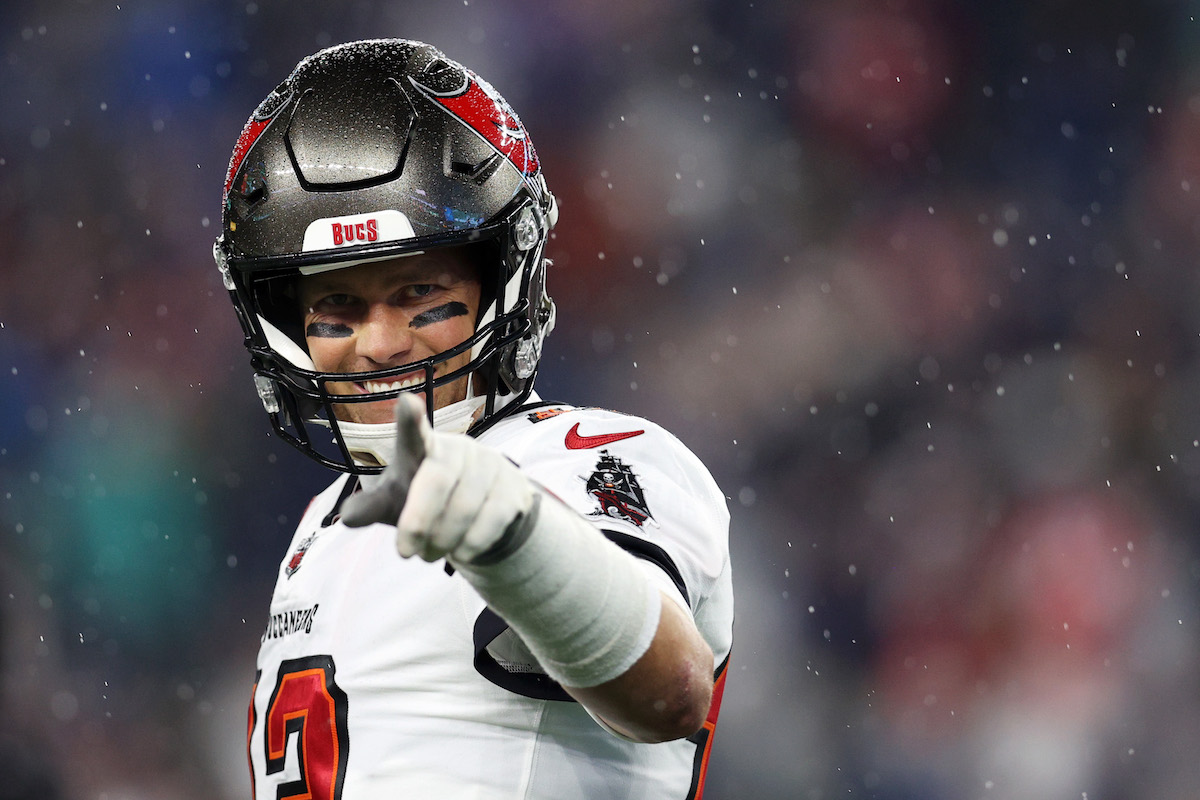 Tom Brady, #12 of the Tampa Bay Buccaneers, smiles before the game between the New England Patriots and Tampa Bay Buccaneers at Gillette Stadium on October 3, 2021, in Foxborough, Massachusetts