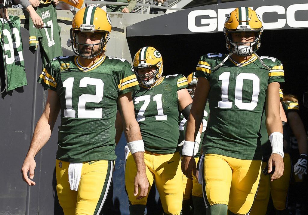 Green Bay Packers quarterback Aaron Rodgers (No. 12) and Jordan Love (No. 10) in 2021.