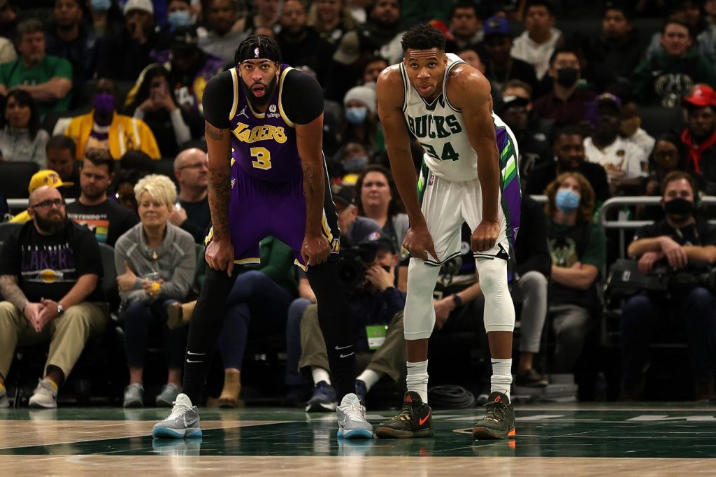 Anthony Davis of the Los Angeles Lakers and Giannis Antetokounmpo of the Milwaukee Bucks await a free throw.