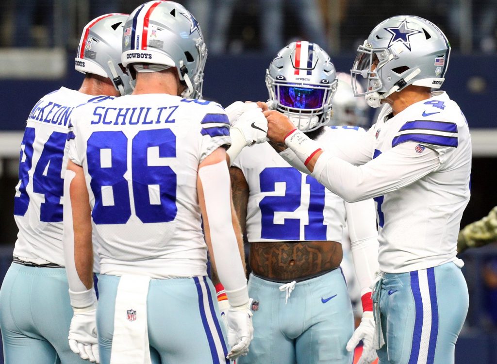 Ezekiel Elliott and Dallas Cowboys teammates