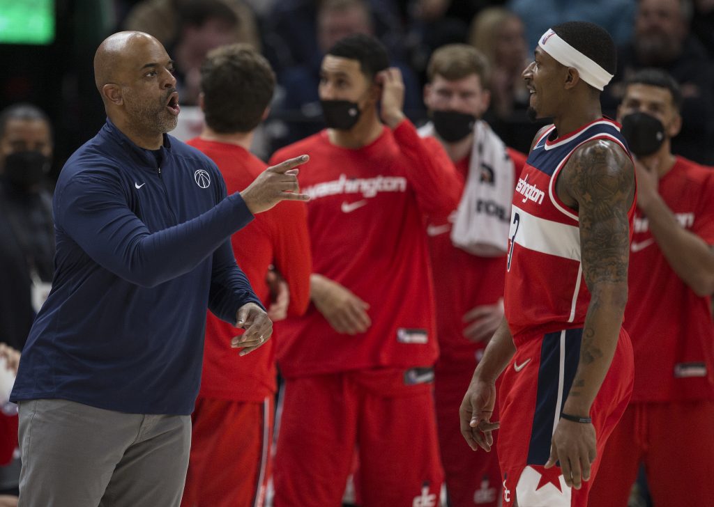 Washington Wizards head coach Wes Unseld Jr. talks to Bradley Beal during a game against the Utah Jazz