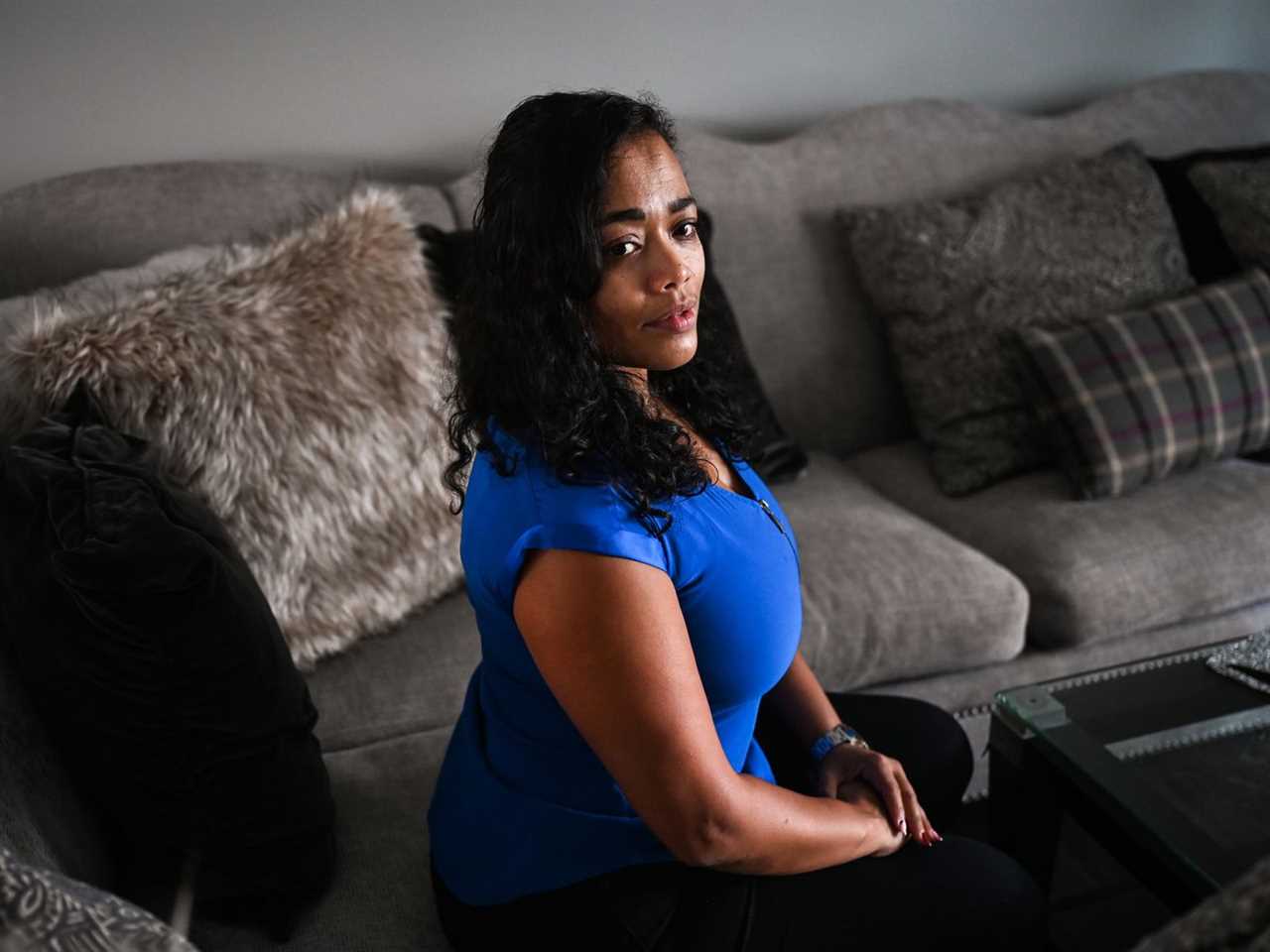 A woman sitting in her living room.