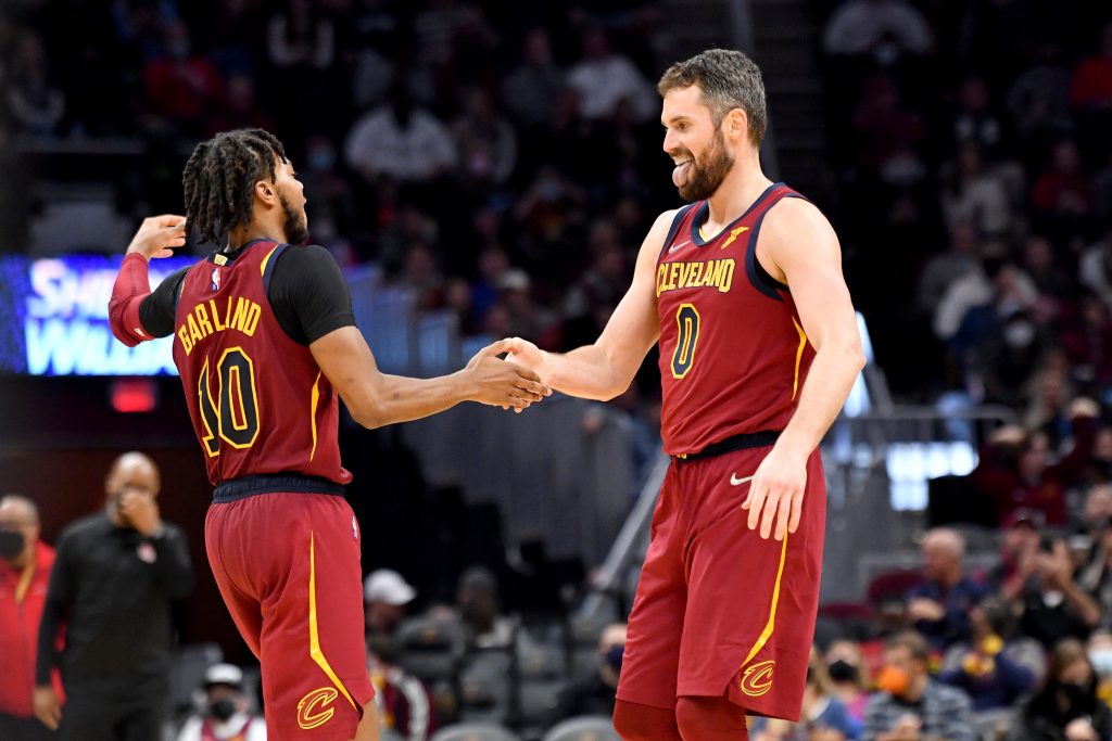 Cleveland Cavaliers stars Kevin Love (R) and Darius Garland celebrate during an NBA game against the Toronto Raptors in December 2021