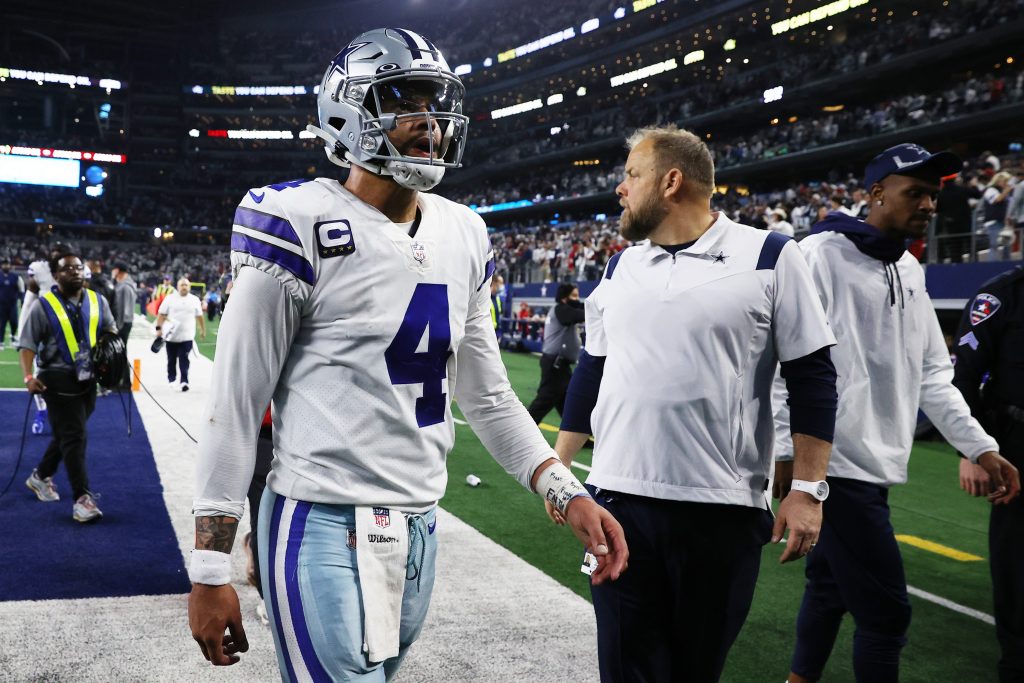 Cowboys QB Dak Prescott walks off the field after losing to the 49ers