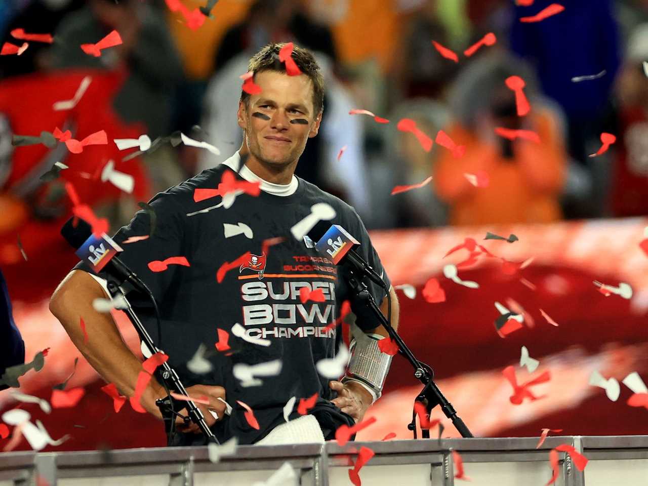 Tom Brady surrounded by confetti.