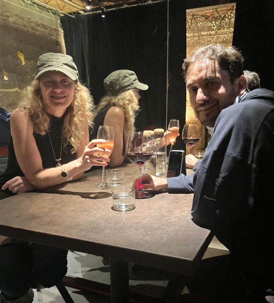 a couple sitting around a table at flor de lis restaurant