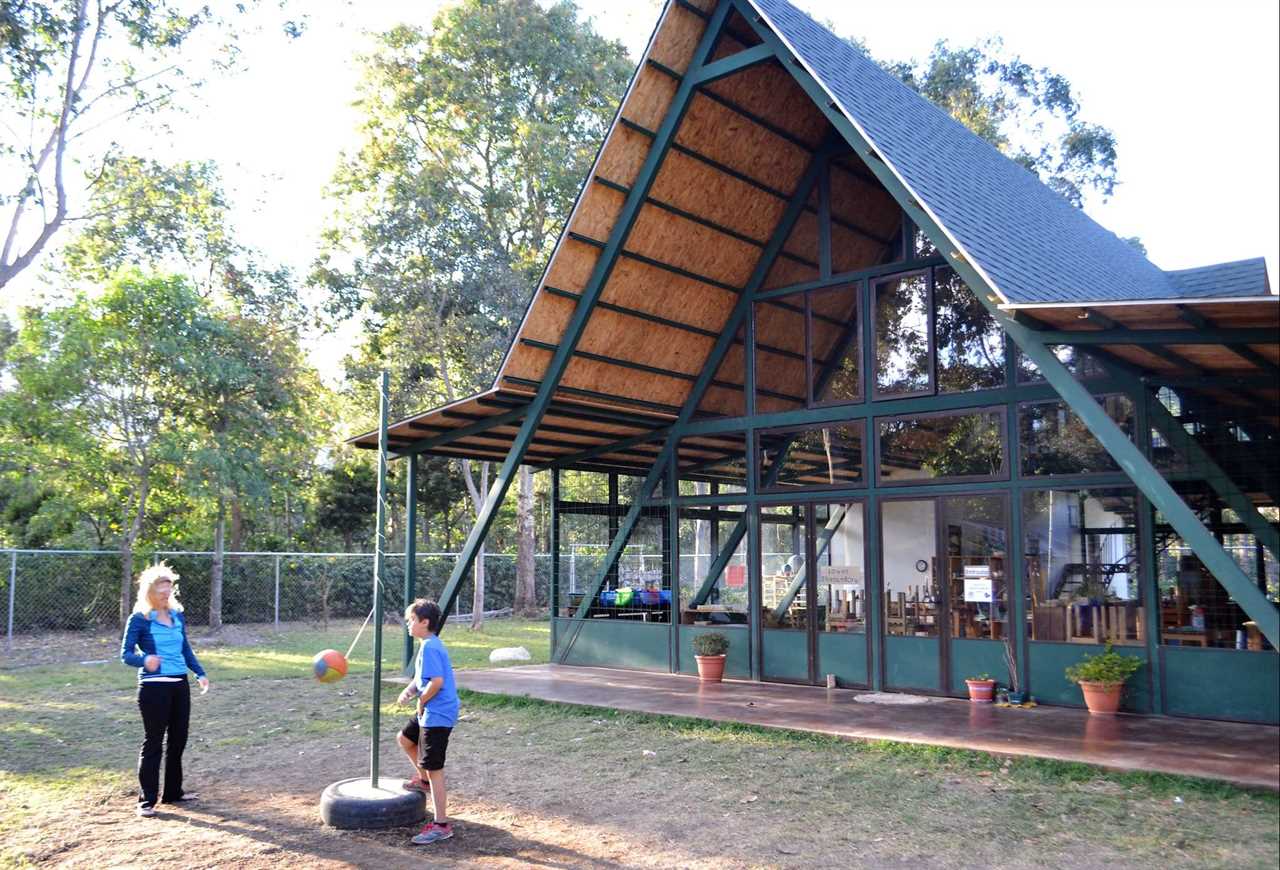 mom and kid playing outside antigua green school