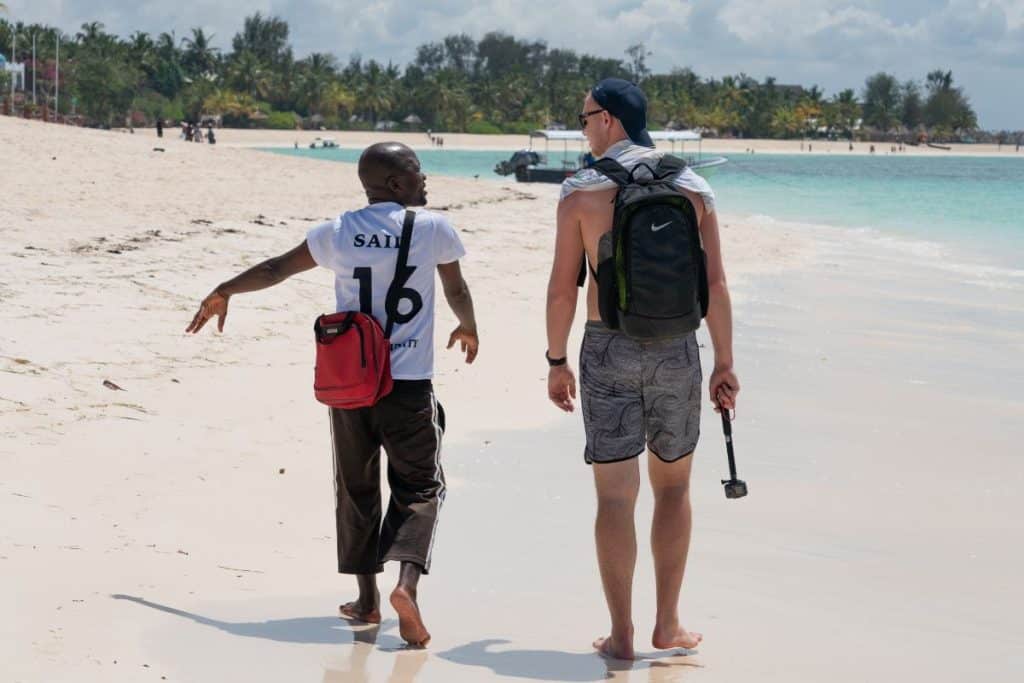 traveler walking with a local