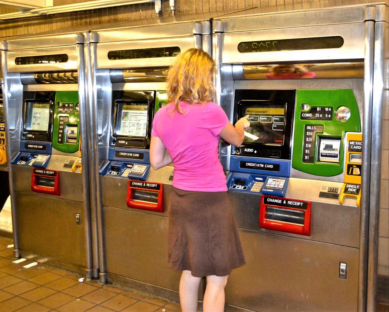 woman buying a metrocard for nyc subway