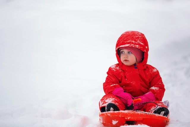 A child playing in the snow