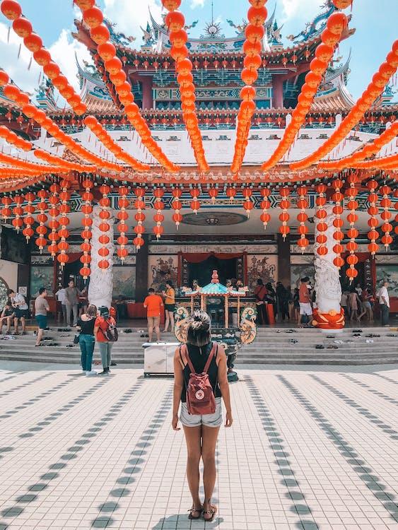 Free Woman Standing In Front Of Building Stock Photo