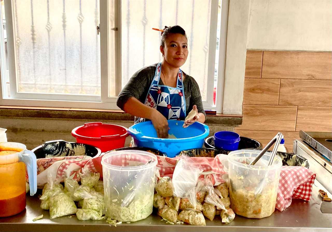 woman selling street food in guatemala