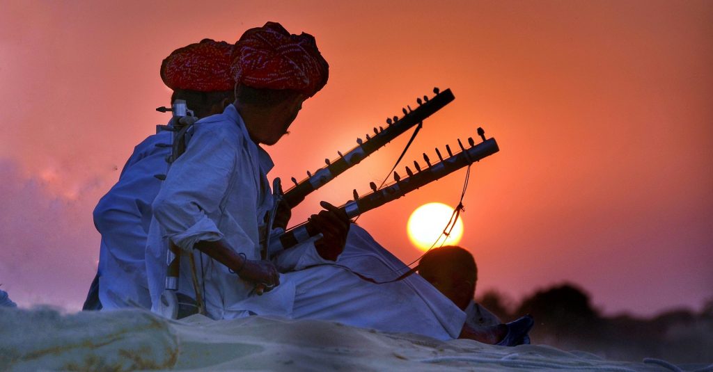 people playing music sunset in rajasthan