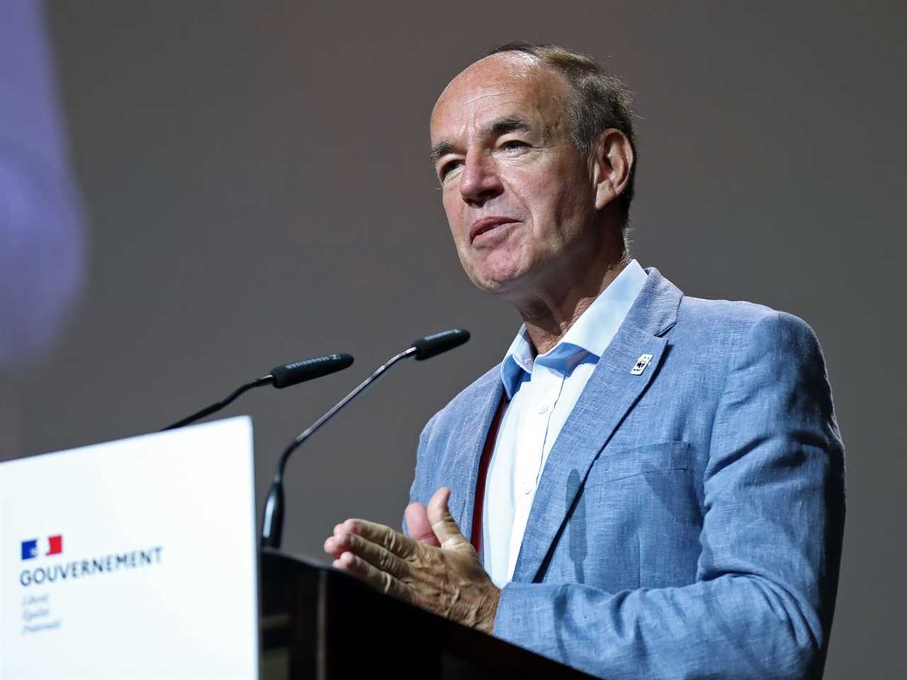 Marco Lambertini speaks from behind a podium. 