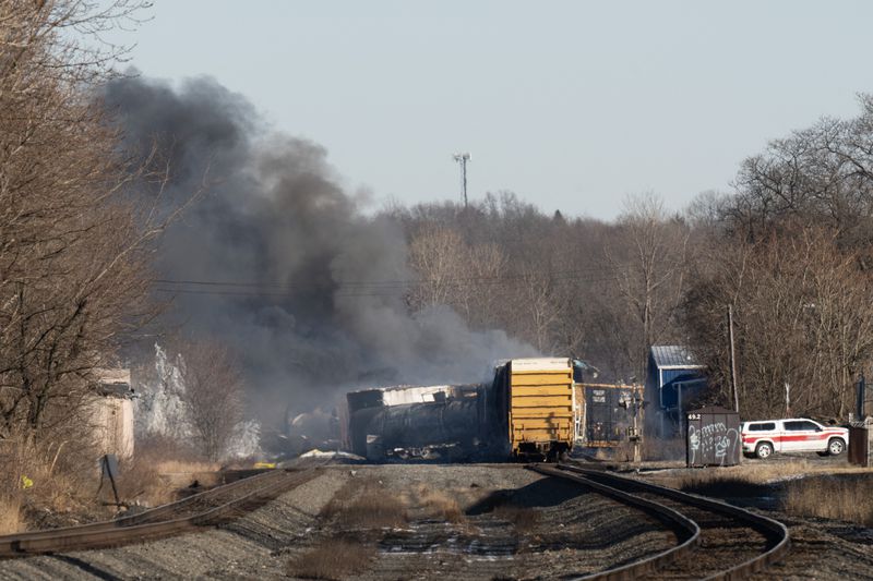 Smoke rises from a derailed cargo train in East Palestine, Ohio, on February 4, 2023.