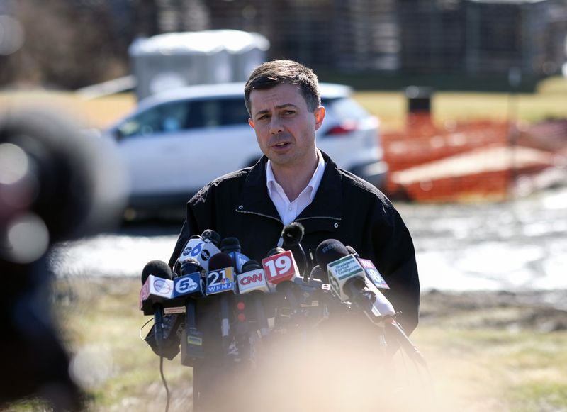 Pete Buttigieg speaks during a news conference near the site of the Norfolk Southern train derailment in East Palestine, Ohio.