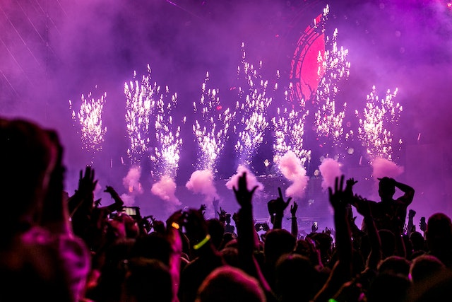 people enjoying nightlife with fireworks