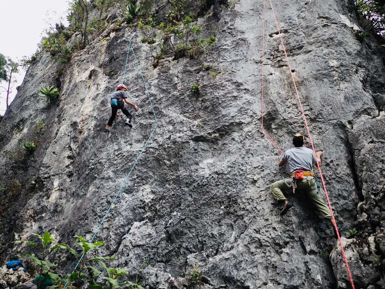 a kid and a man rock climbing in san cristobal de las casas