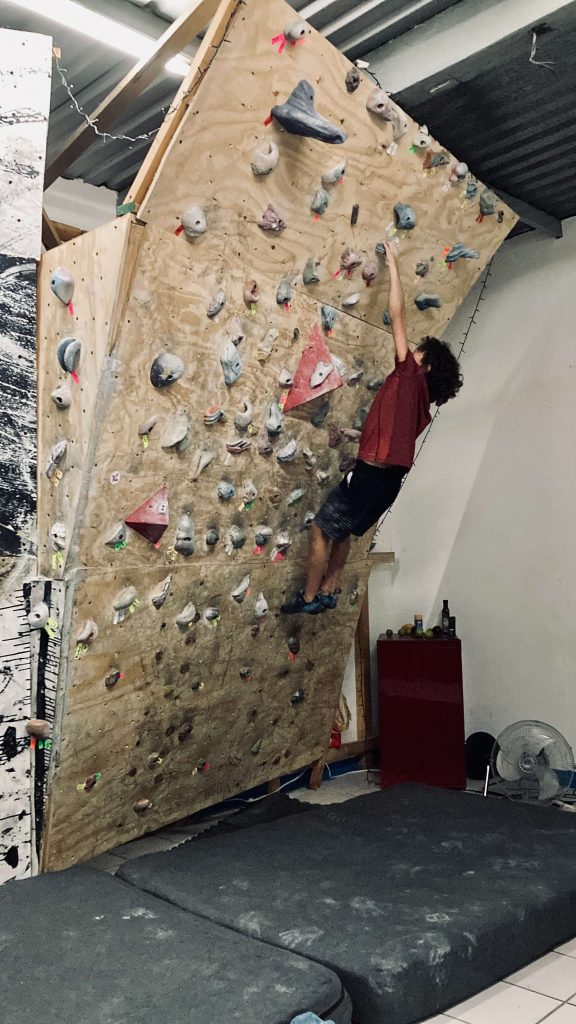 kid climbing on a board in vertigo climbing gym san cristobal mexico