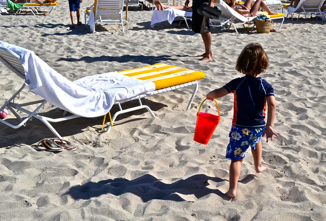 kid playing with sand in miami beach florida