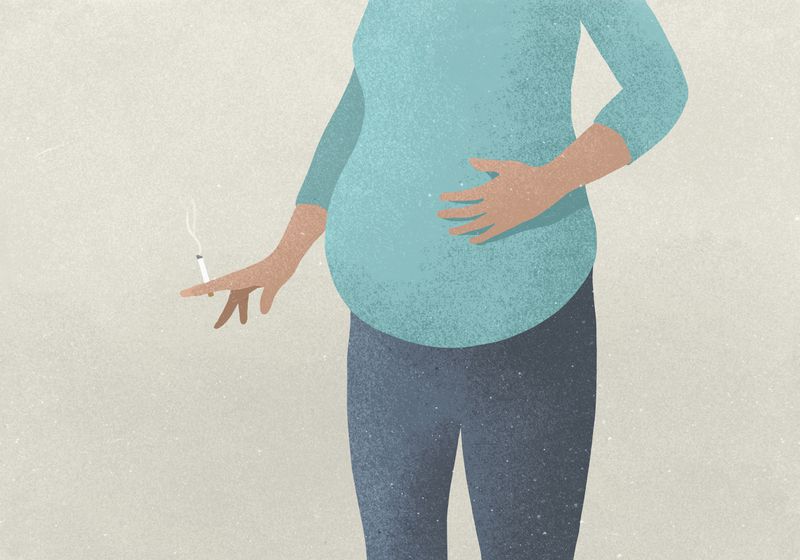 Illustration of a headless pregnant body whose hand is holding a lit cigarette.