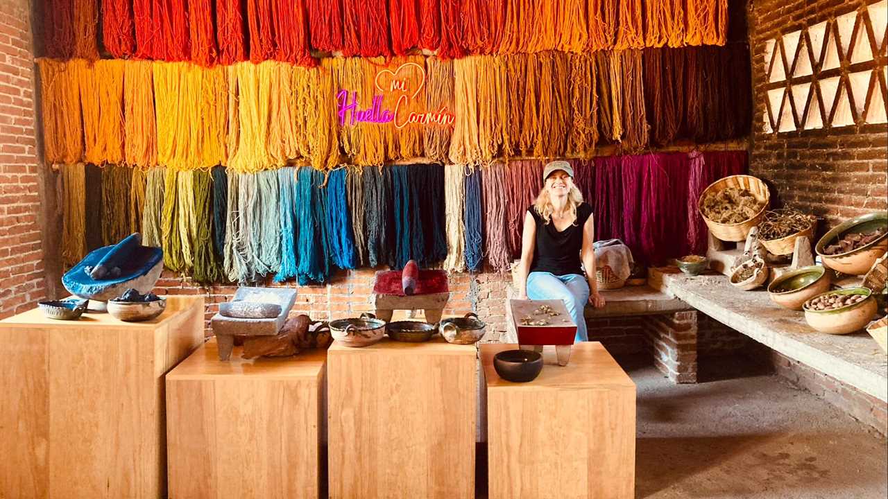 woman sitting and natural dyed threads in Teotitlan del Valle