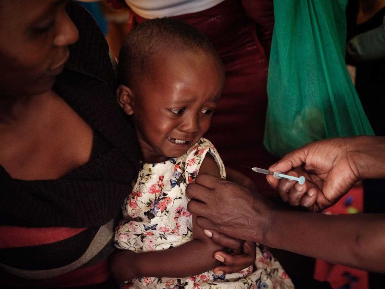 Child receives malaria vaccine in Kenya