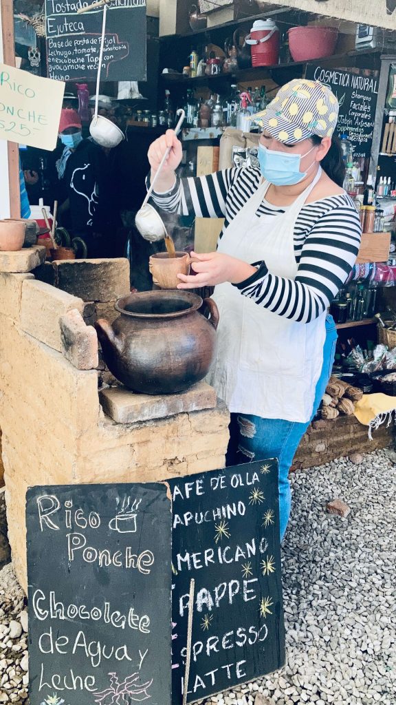 woman selling ponche in oaxaca food market