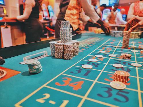 A close-up of a roulette table, with numbered pockets 