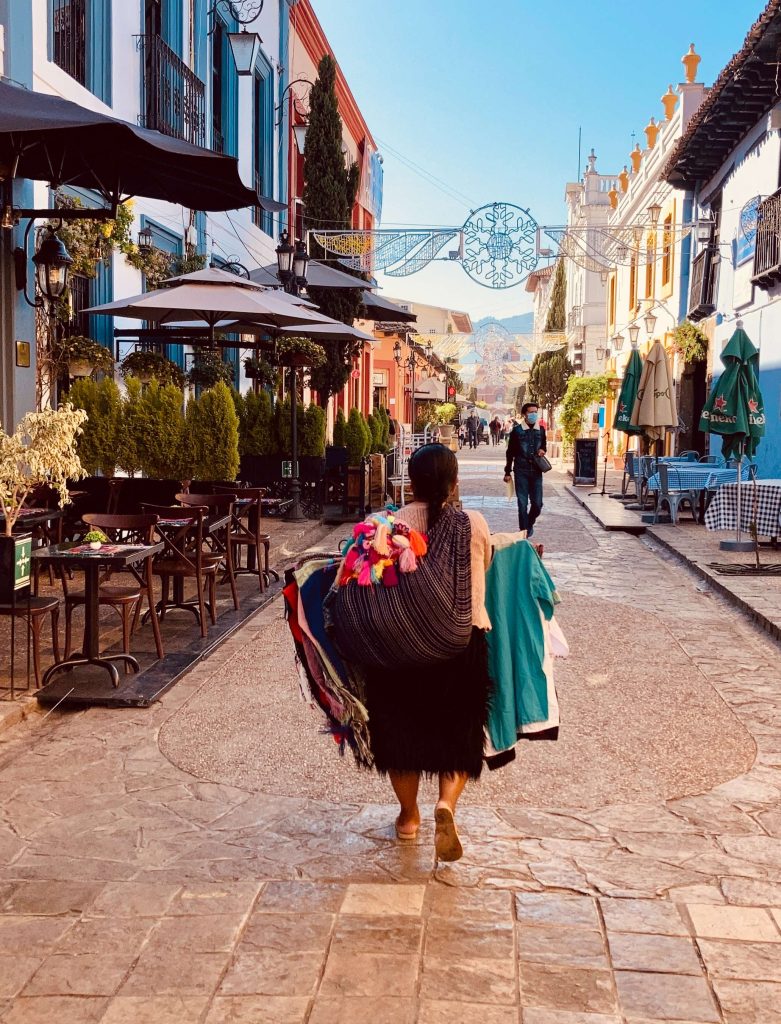 Local woman walking in a street in san cris mexico
