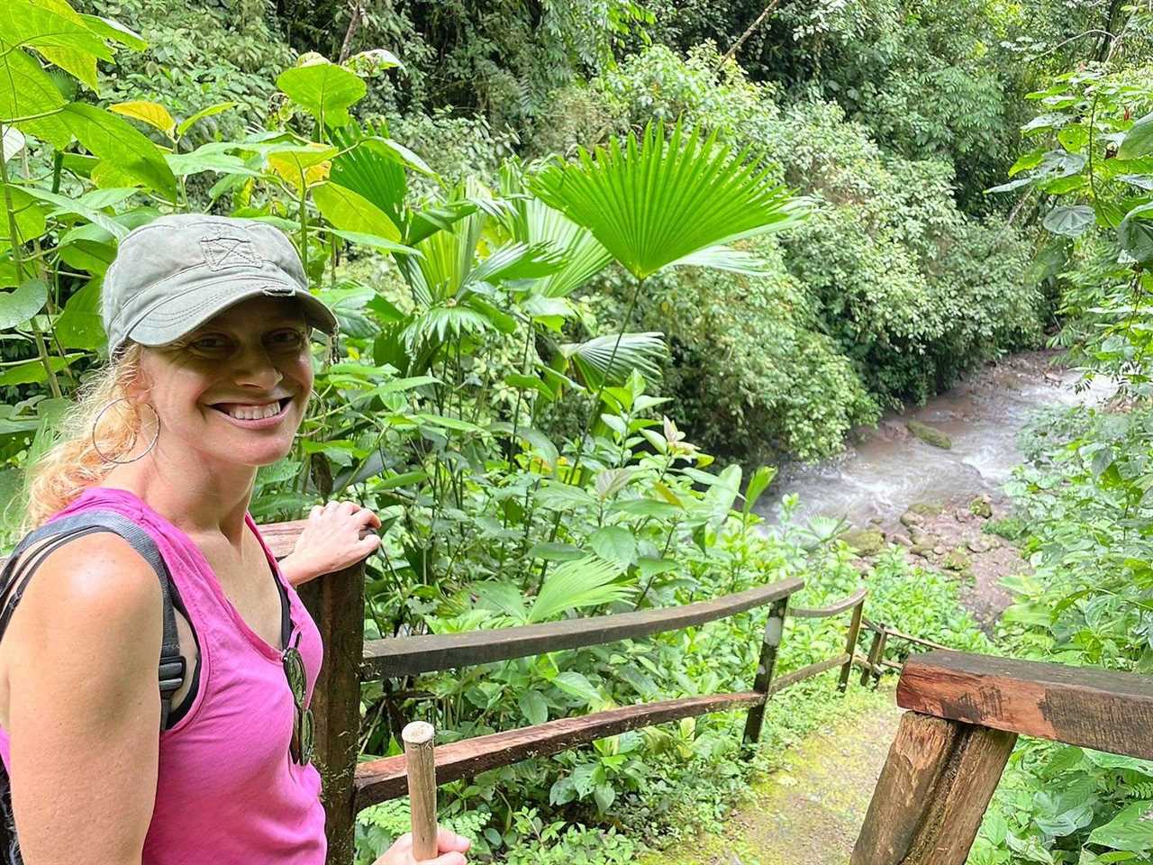 woman near a river in rainmaker park costa rica