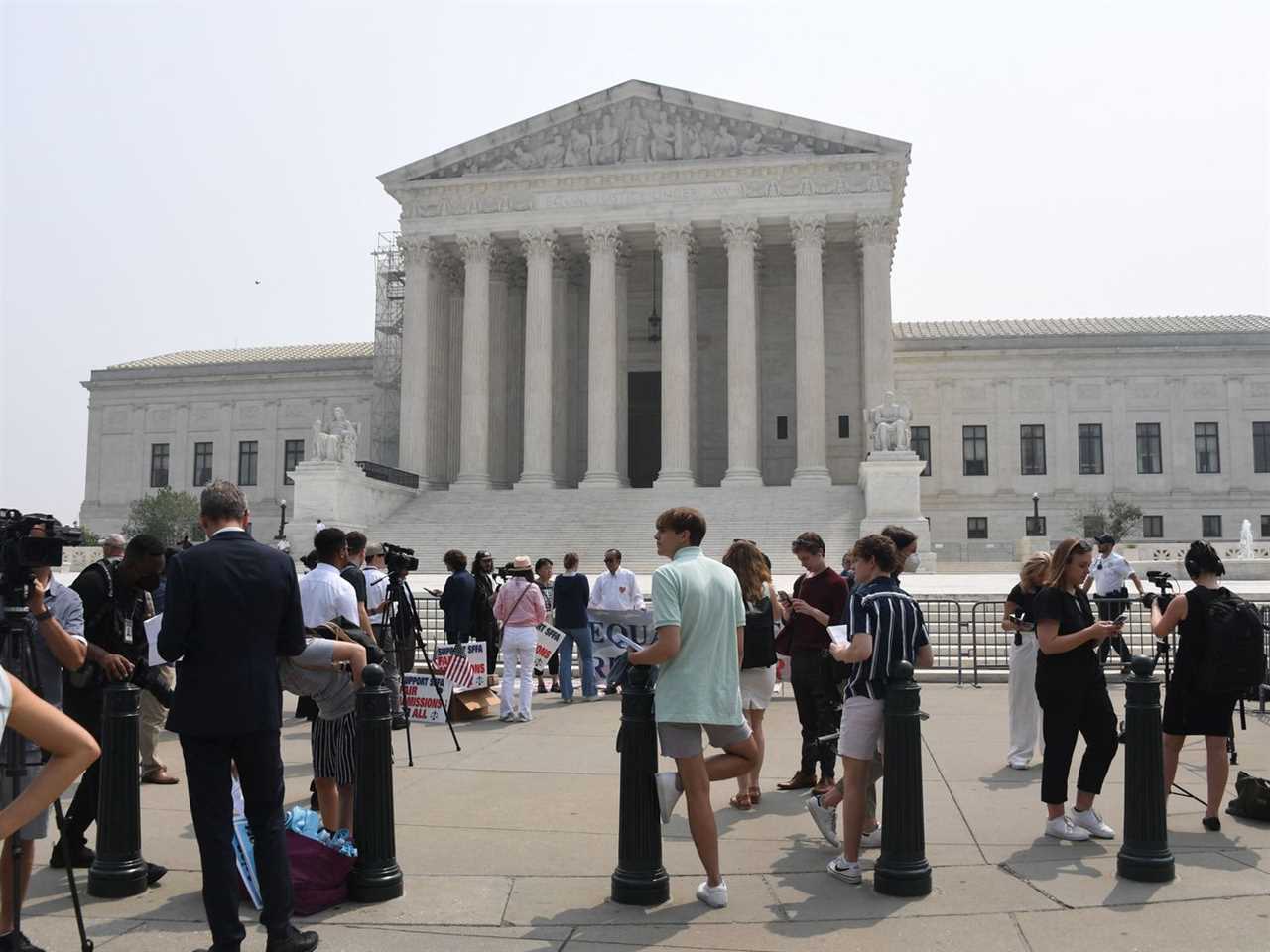 Protesters seen outside the Supreme Court. 