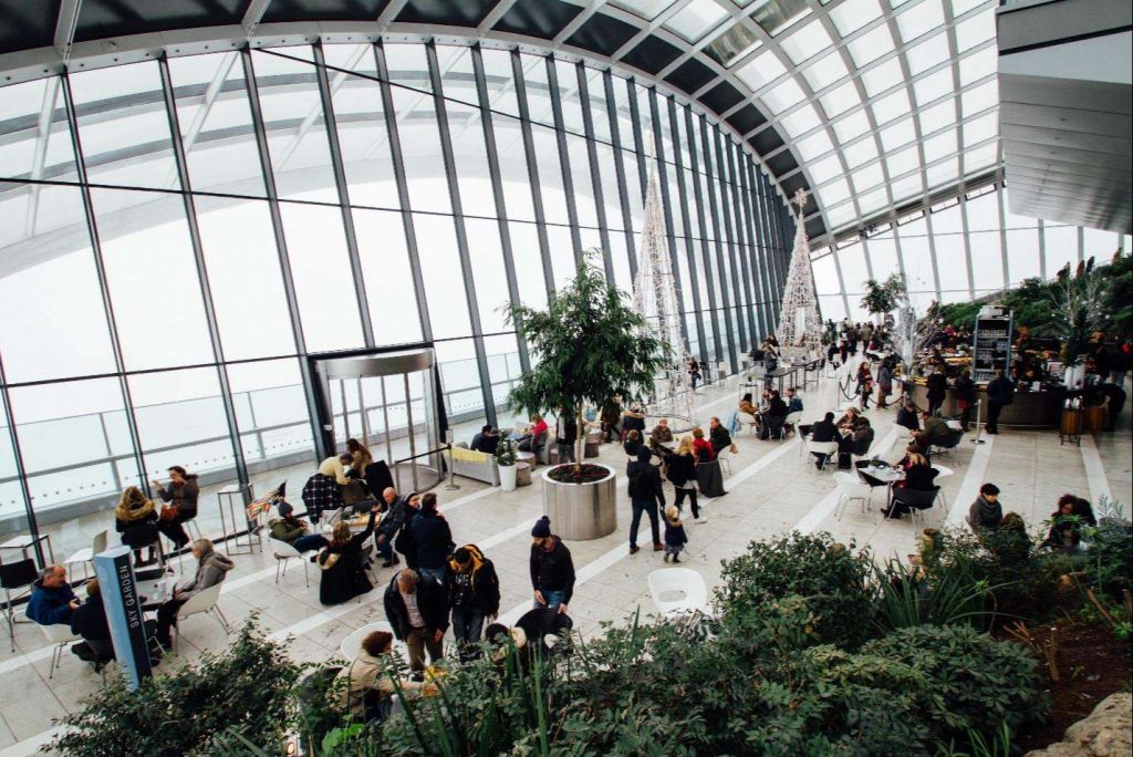 A group of people inside a greenhouse