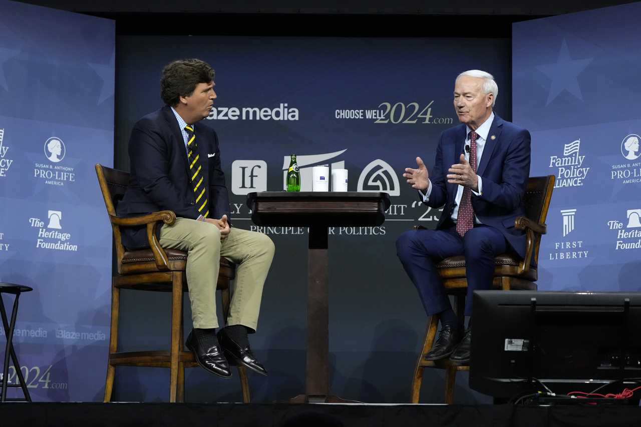 Asa Hutchinson and Tucker Carlson disagree on the vaccination status