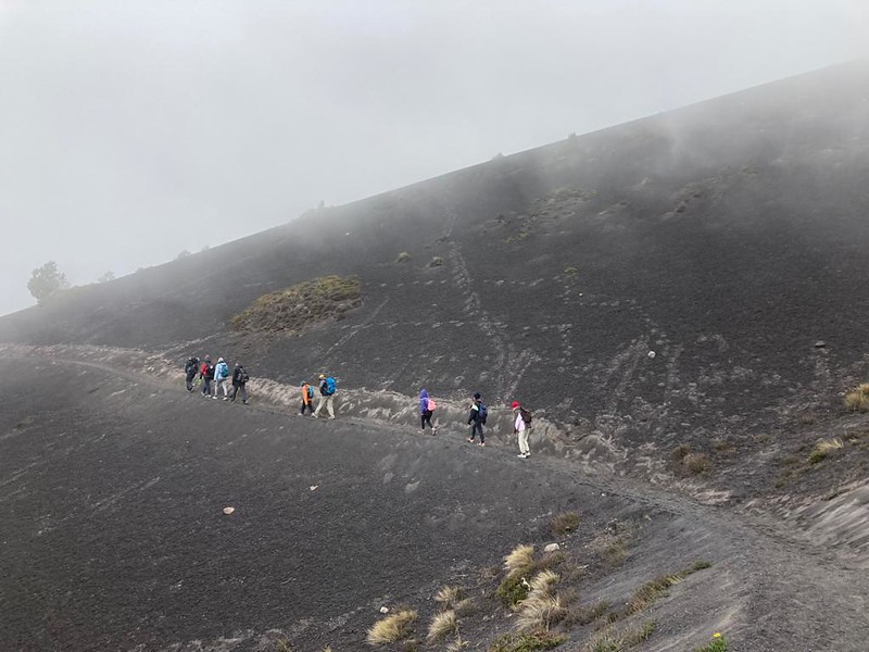 a group of people hiking to the top of acantenango volcano