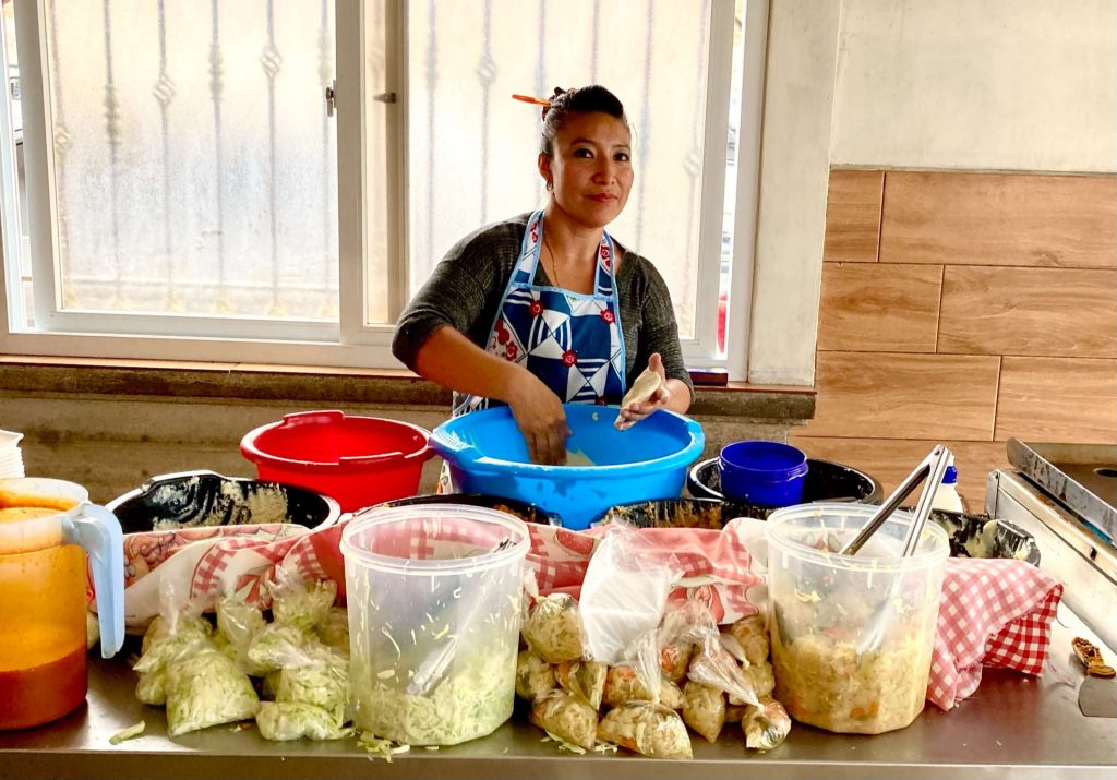 woman selling street food in guatemala