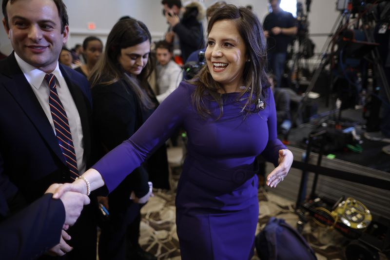 Elise Stefanik shakes a supporter’s hand. 