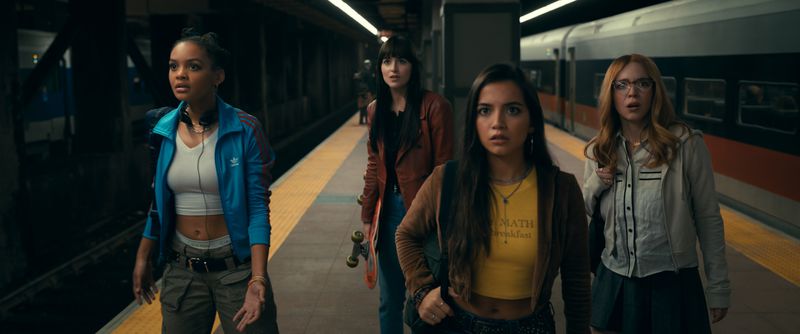 Celeste O’Connor as Mattie Franklin, Johnson as Cassie Webb, Isabela Merced as Anya Corazon, and Sweeney as Julia Cornwall look concerned on a subway platform.