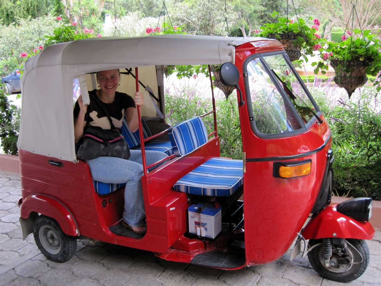 woman sitting on a tuk tuk in guatemala