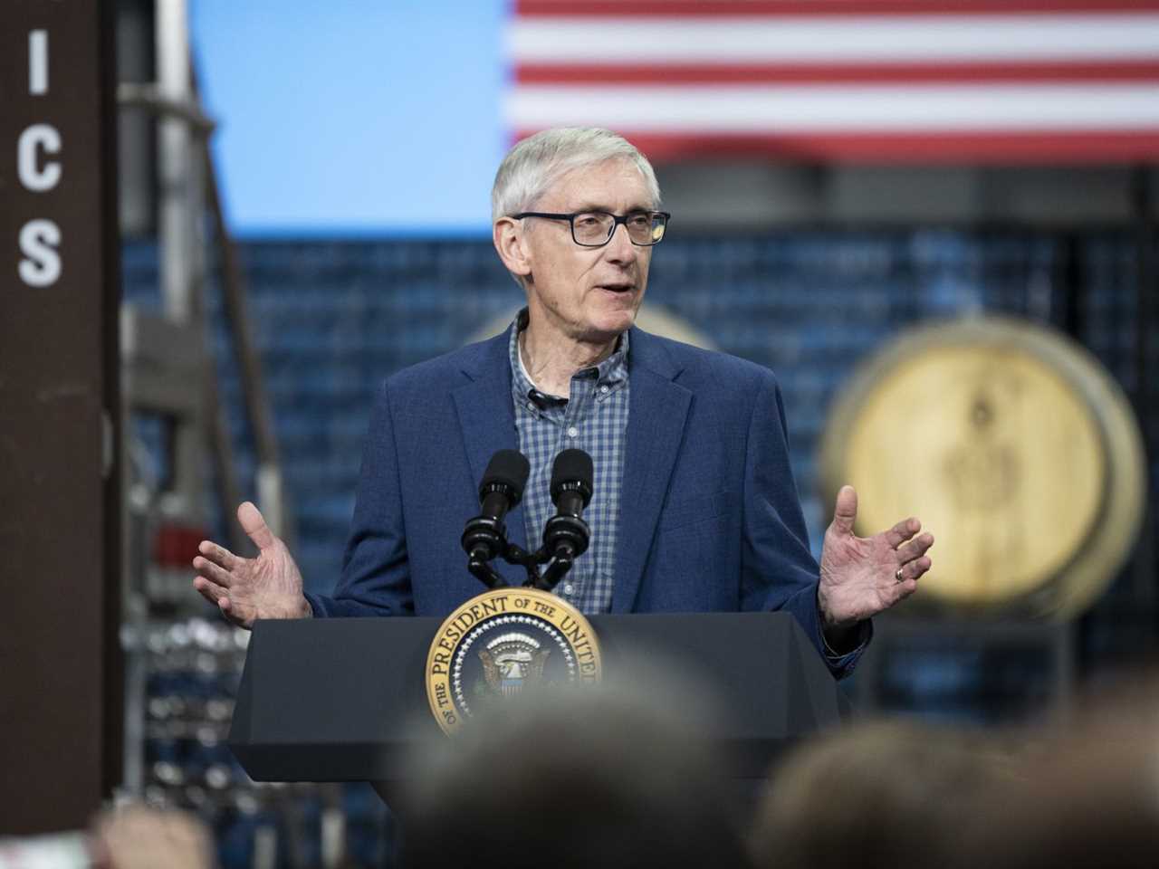 Tony Evers speaks at a podium.